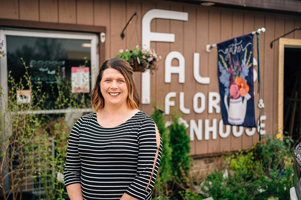 Falls Florist & Greenhouse owner Dana Rave in front of her shop